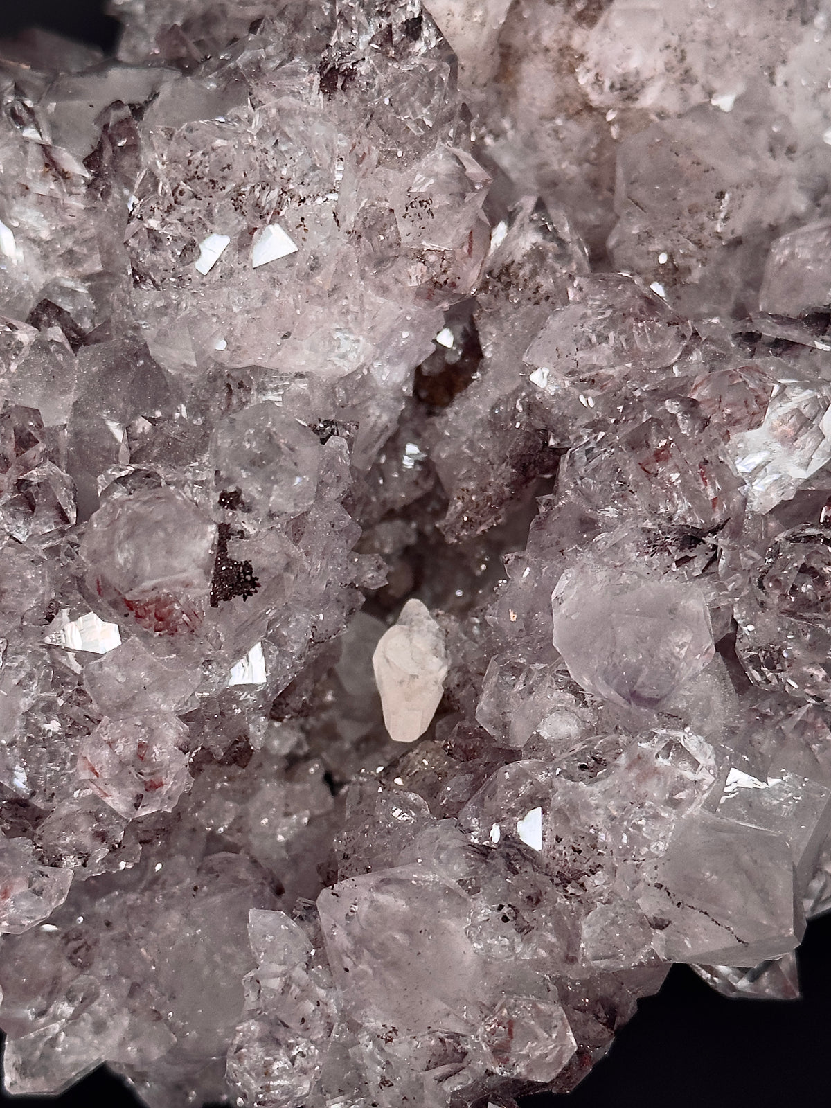 Close-up of pale pinkish-lavender quartz amethyst crystal points with a calcite crystal — one-of-a-kind mineral specimen.