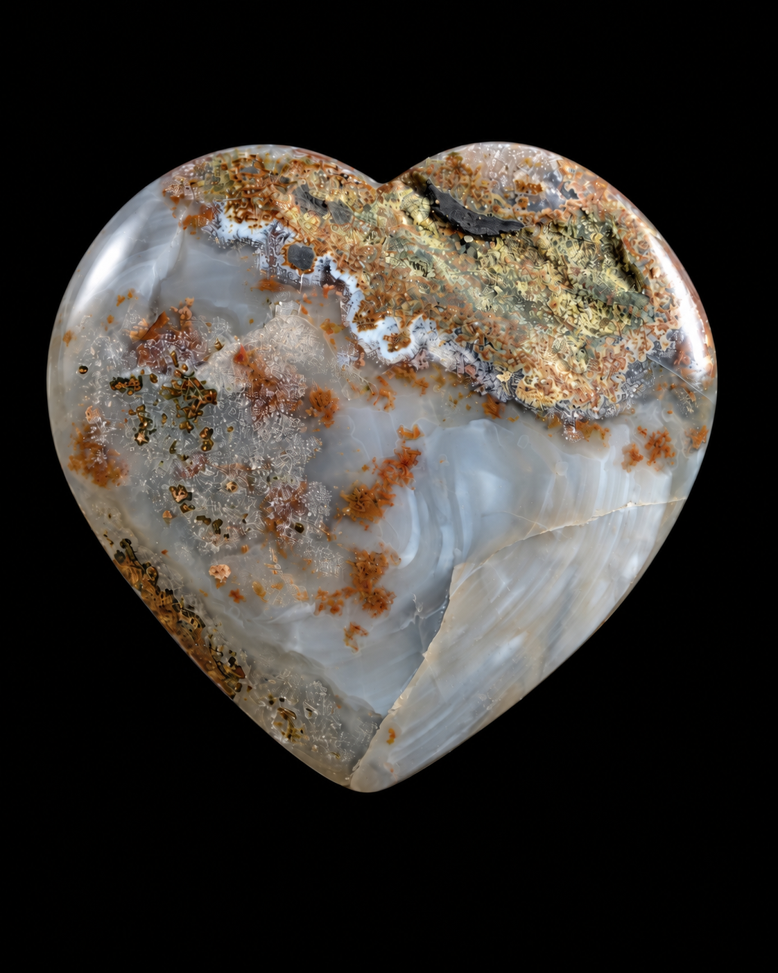 A heart-shaped polished agate stone with natural banded patterns in white, gray-blue, and rust-brown.