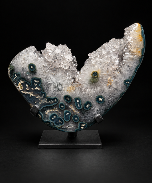 Sculptural agate specimen with stalactite eyes in clear quartz and deep green banding, on a black stand — one-of-a-kind.